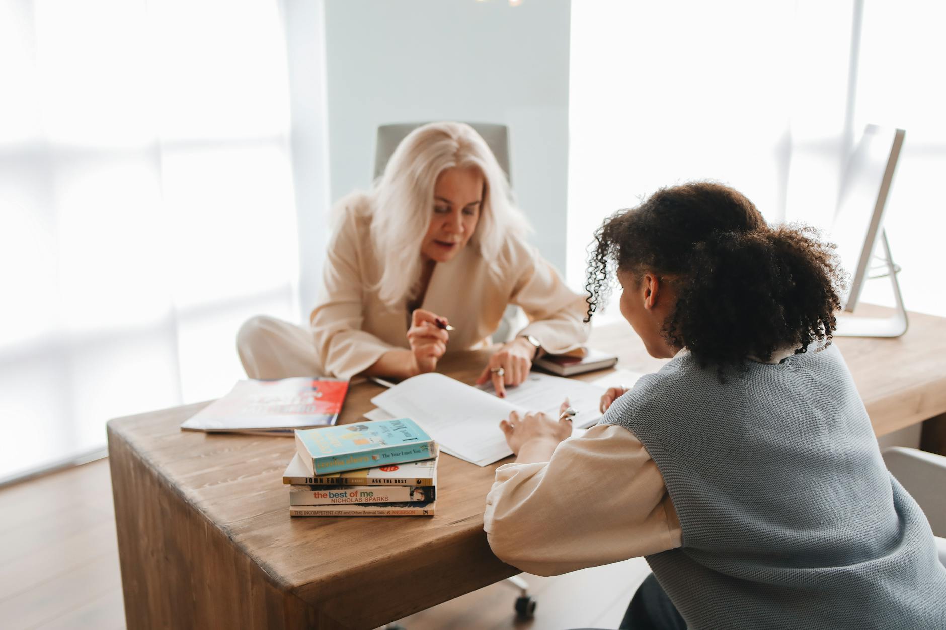 teacher discussing her lesson with her student