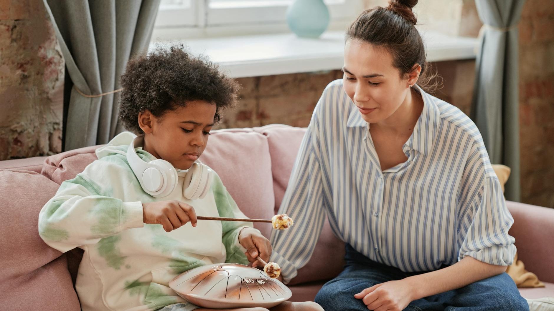 mother and child sitting on sofa having bonding time